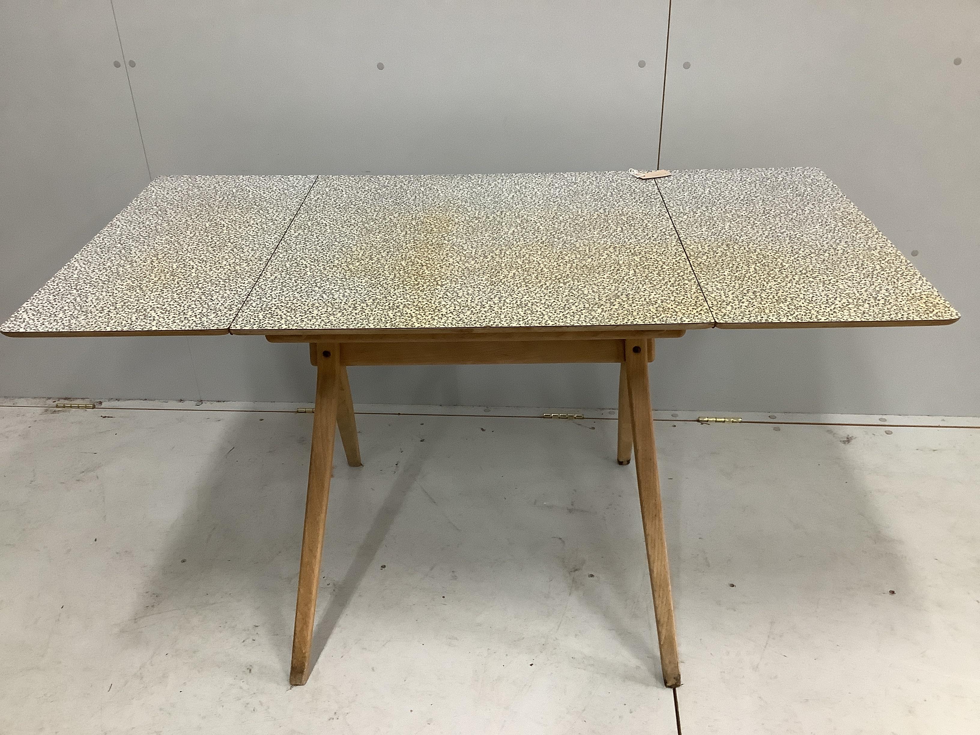A mid century oak and melamine drop flap dining table, width 70cm, depth 68cm, height 73cm together with a Parker Knoll teak two tier occasional table